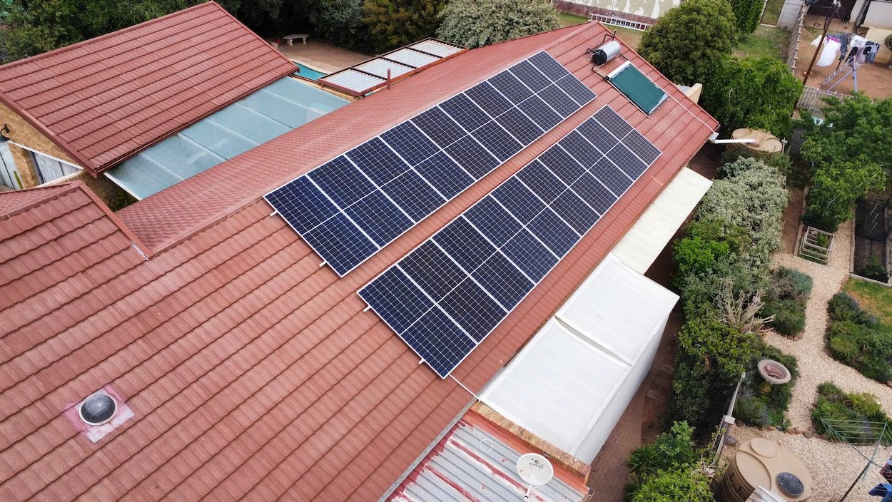 Aerial view of a completed solar PV roof installation